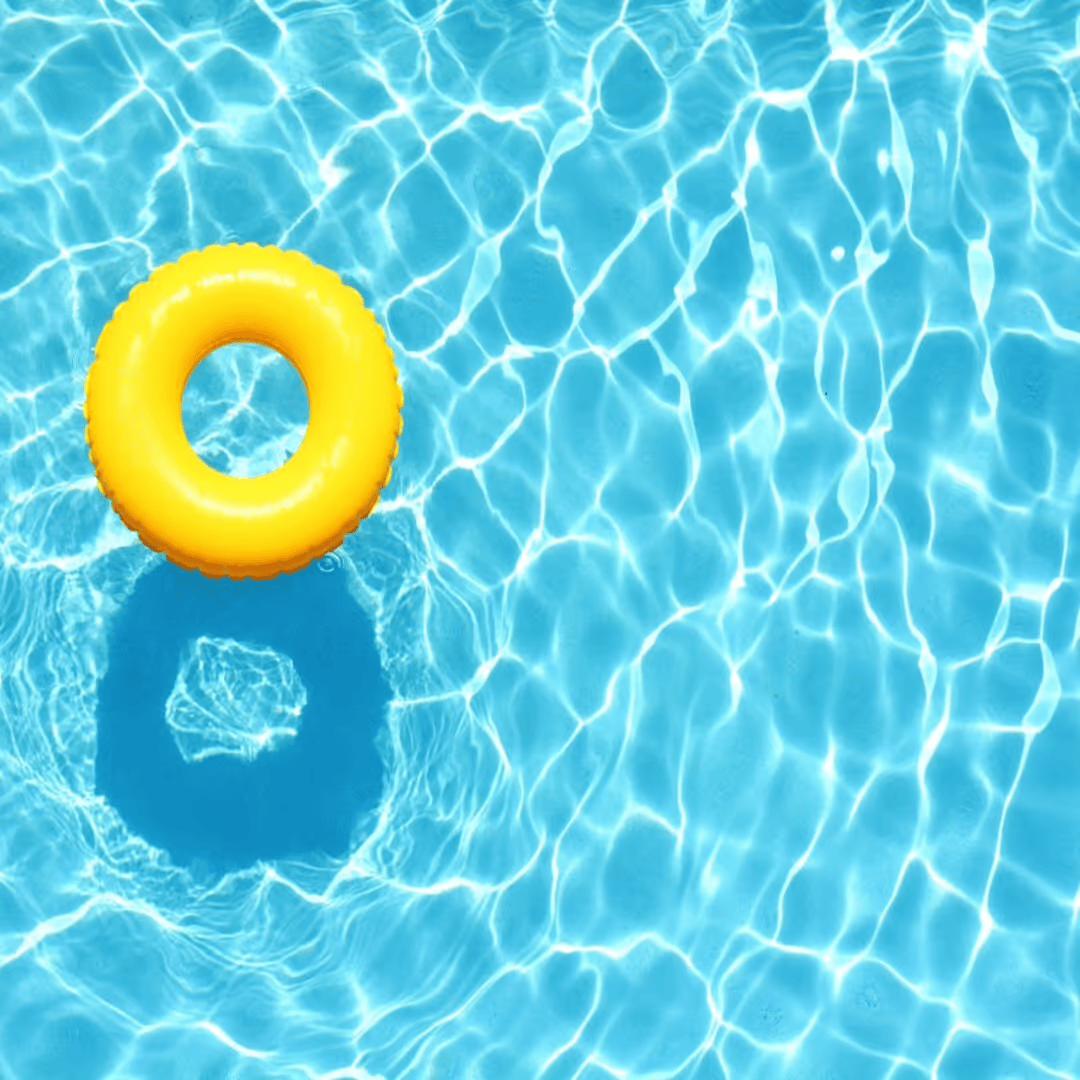 Aerial view of pool water with yellow float ring on the left side